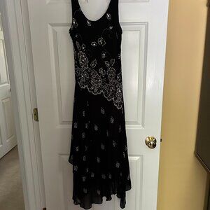 Midnight Velvet Sleeveless dress with hankerchief hem. Size medium.